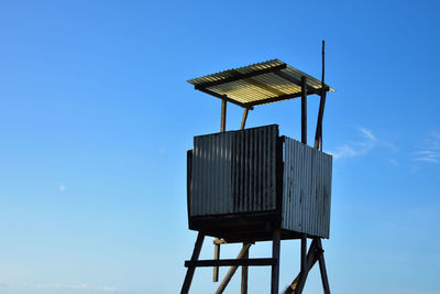 Low angle view of hut against sky