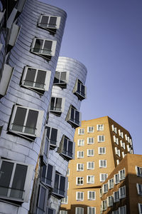 Low angle view of modern building against clear sky