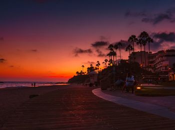 Scenic view of beach against sky during sunset