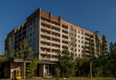 Low angle view of building against blue sky