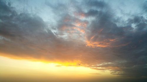 Scenic view of cloudy sky at sunset