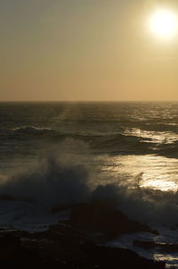 Scenic view of sea against clear sky during sunset