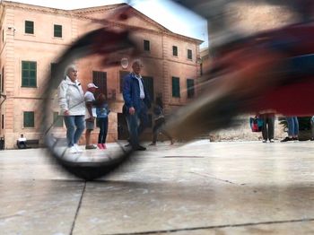 People walking on street in city