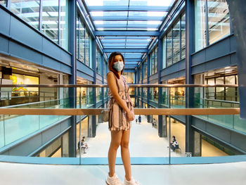 Full length of woman standing in building