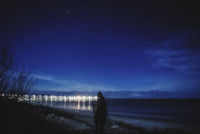 Scenic view of sea against sky at night