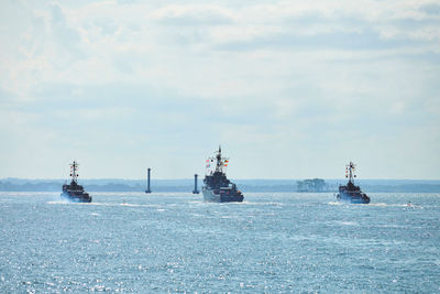 Three battleships war ships maneuvering during naval exercises in baltic sea. warships and boats