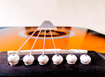 Close-up of guitar on table