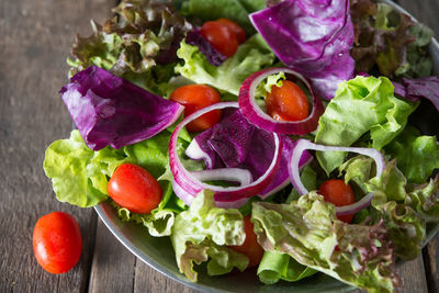 Close-up of chopped fruits in bowl on table