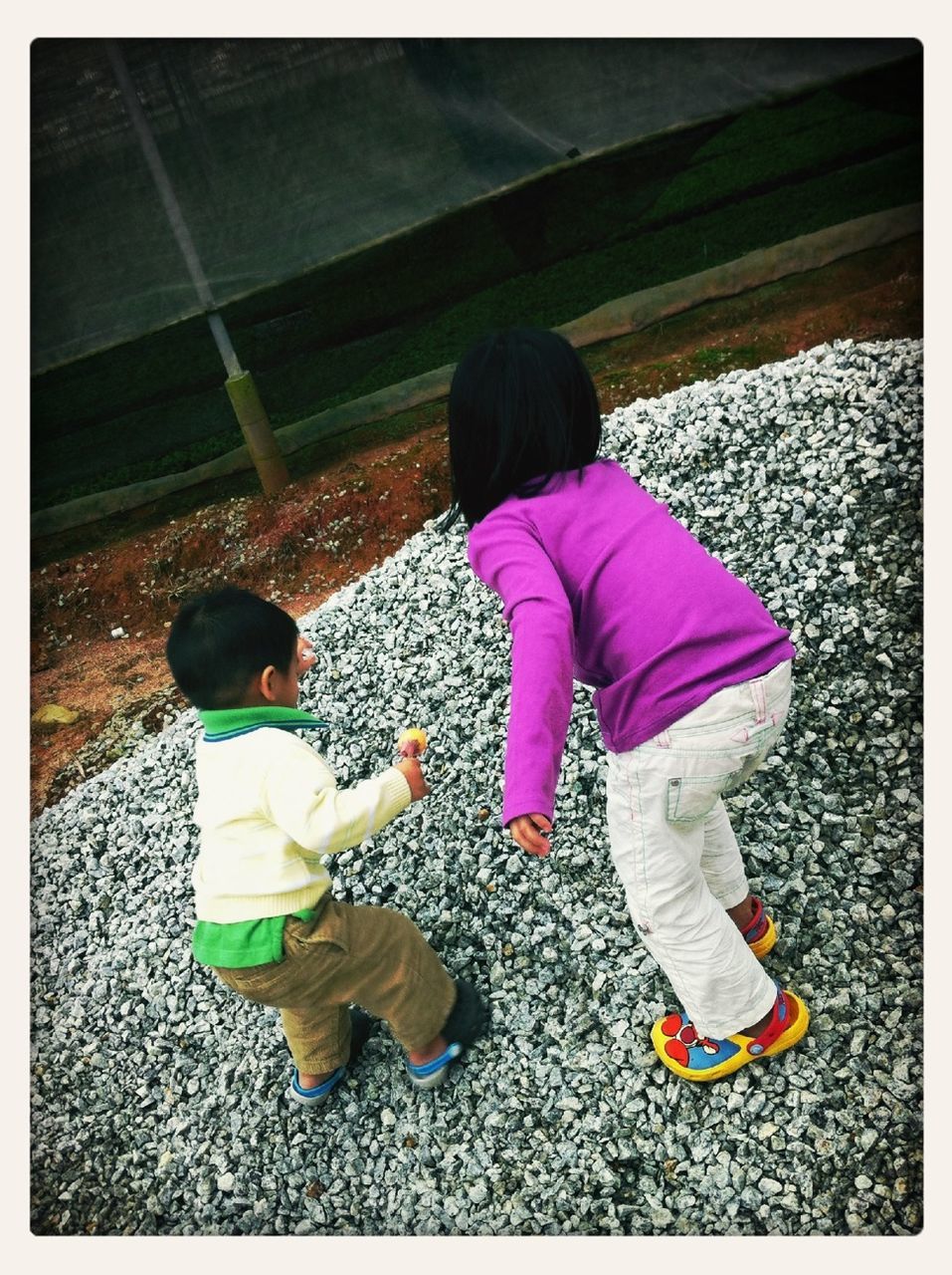 transfer print, childhood, lifestyles, girls, leisure activity, auto post production filter, elementary age, full length, casual clothing, boys, rear view, standing, togetherness, day, innocence, umbrella, walking