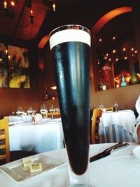 Close-up of beer glass on table at restaurant