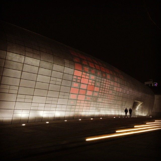 illuminated, night, transportation, built structure, architecture, lighting equipment, road, dark, indoors, copy space, tunnel, road marking, street, the way forward, light - natural phenomenon, city life, railroad station, sky, incidental people