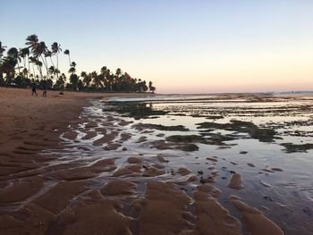 View of beach at sunset