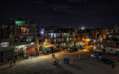 High angle view of illuminated street at night