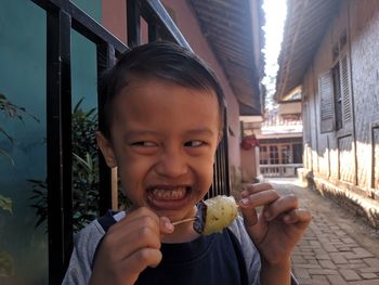 Portrait of smiling boy holding ice cream