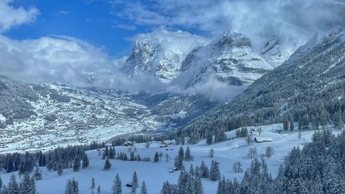 Scenic view of snowcapped mountains against sky