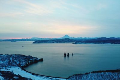 Scenic view of sea against sky during winter