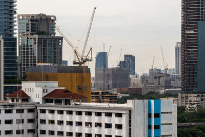 Bangkok, thailand - 10 august 2022 - view of bangkok cityscape high-rises and construction cranes