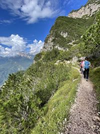 Rear view of people on a turistic walk on high mountain. wonderful view of the nature 