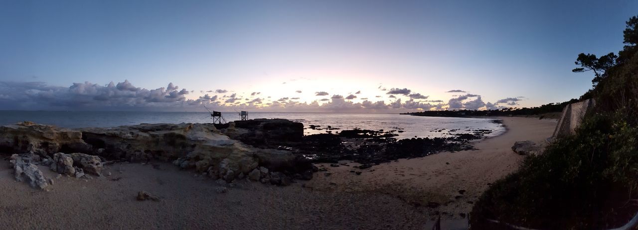 sky, water, sea, scenics - nature, beauty in nature, beach, land, horizon over water, horizon, nature, sunset, tranquility, tranquil scene, non-urban scene, outdoors, idyllic, sand, rock, cloud - sky