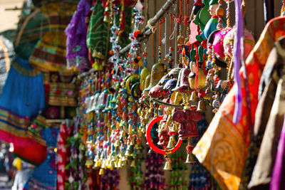 Bunch of colorful decorative item as souvenir being hanging as display for sale in commercial street