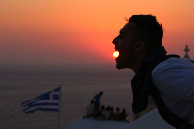 Portrait of man on beach during sunset