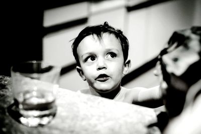 High angle view of boy by table at home