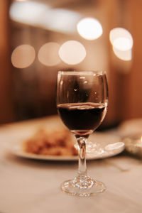 Close-up of wineglass on table