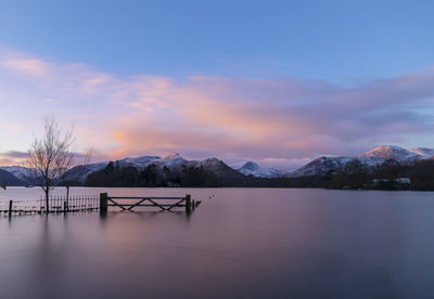 Scenic view of lake against sky during sunset