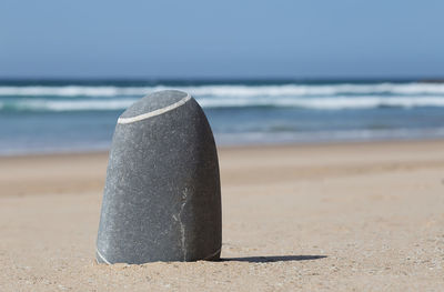 Close-up of sea shore against sky