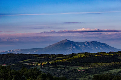 Scenic view of landscape against sky during sunrise 