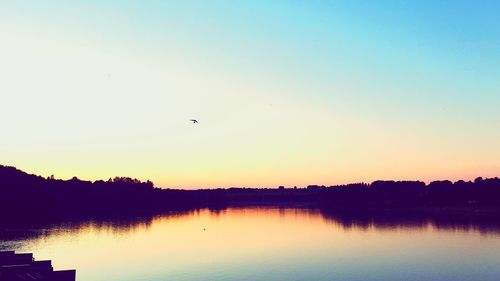 Scenic view of lake against sky during sunset