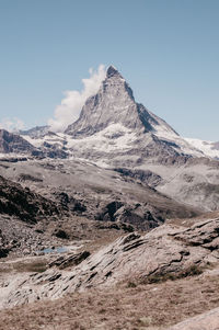 Scenic view of snowcapped mountains against sky