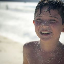 Close-up portrait of boy on beach