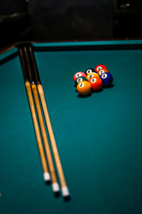 Cropped hand playing pool