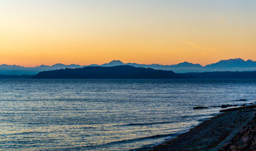 Sunset behind the olumpic mountains across the puget sound.