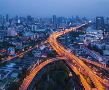 High angle view of illuminated cityscape at night