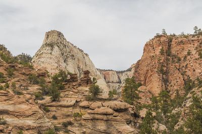 Rock formations on landscape against sky