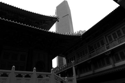 Low angle view of buildings against sky in city