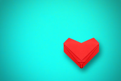 Close-up of heart shape against blue background