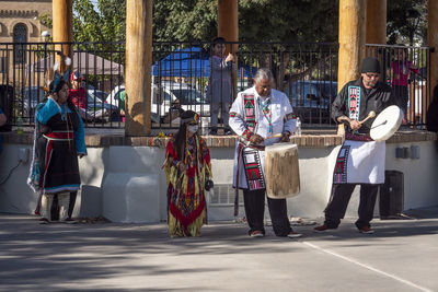 People standing on street in city