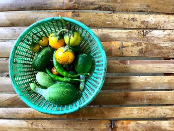 High angle view of fruits in basket on table