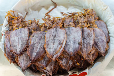 Close-up of dead fish on barbecue grill