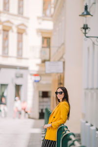 Portrait of woman with yellow umbrella