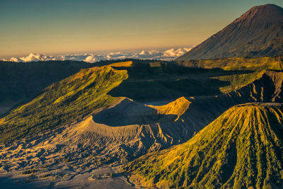 Aerial view of snowcapped mountain against sky during sunset