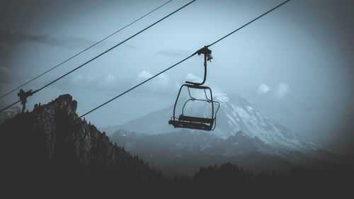 Scenic view of mountains against cloudy sky