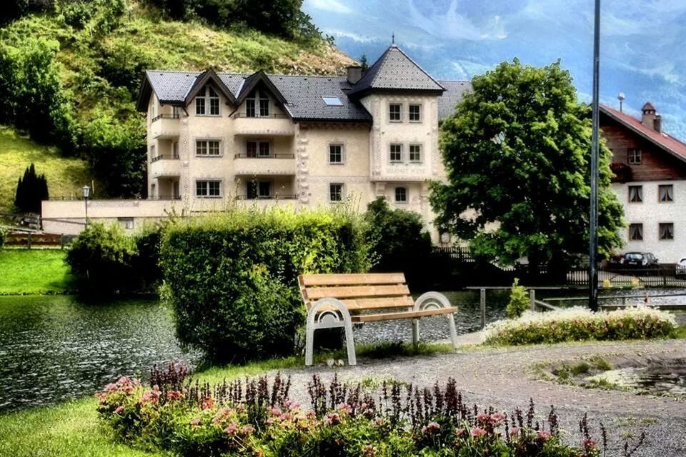 building exterior, architecture, built structure, tree, house, water, sky, plant, residential structure, growth, grass, residential building, green color, nature, cloud - sky, day, cloud, reflection, outdoors, no people