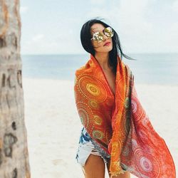 Woman wearing sunglasses on beach