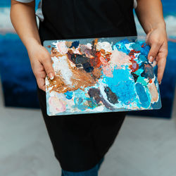 High angle view of person holding paper