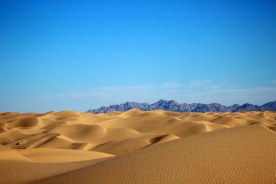 Desert against clear blue sky