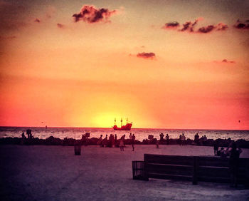 People on beach at sunset